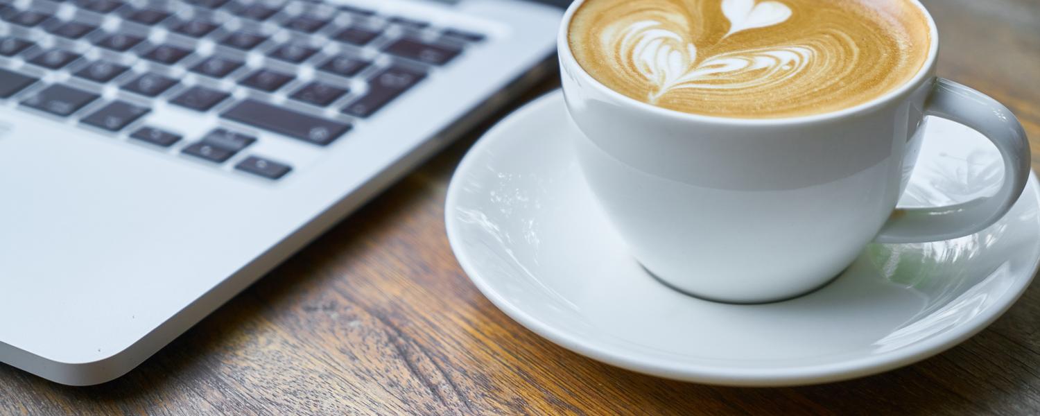 Coffee cup with laptop