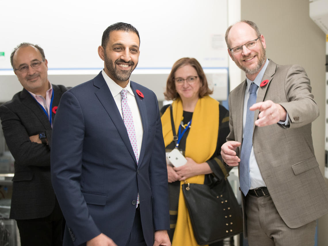 four people on a tour of facility
