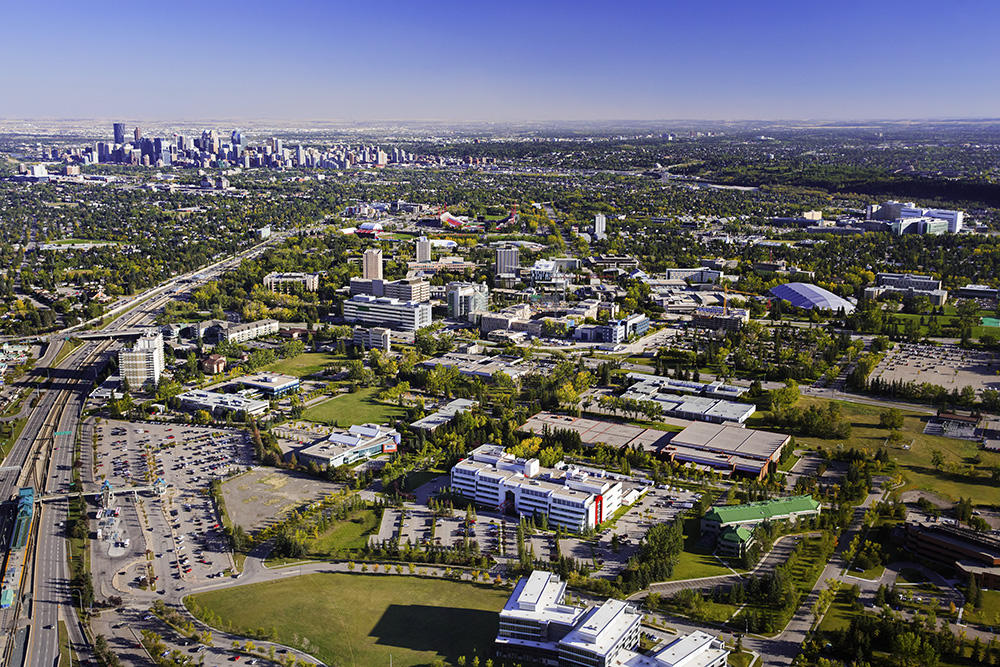 Aerial photograph of UCalgary campus with downtown Calgary in background