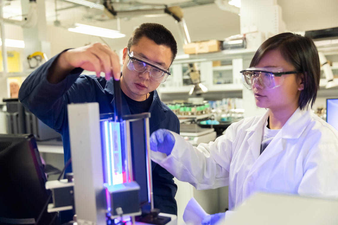 Two people working in a lab
