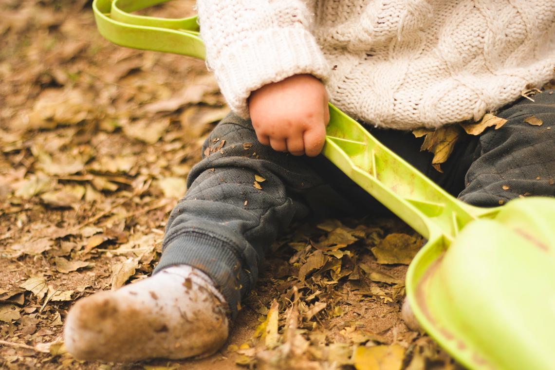 Infant sitting on ground