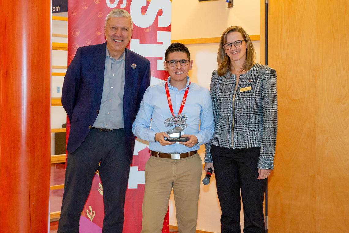 2nd Place Winner Daniel Comaduran Marquez stands with William Ghali and Penny Pexman at the 2023 Postdoc Research Slam.