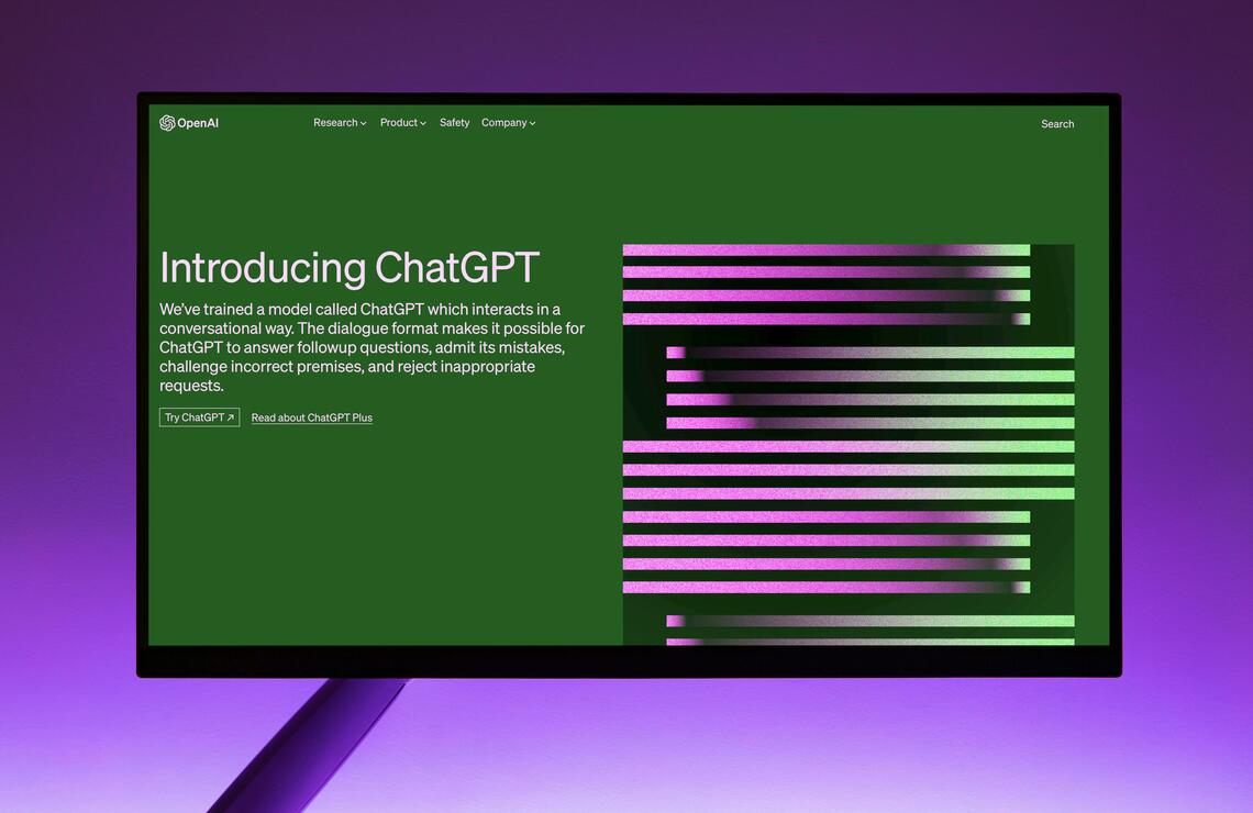 OpenAI Website with Introduction to ChatGPT on Computer Monitor