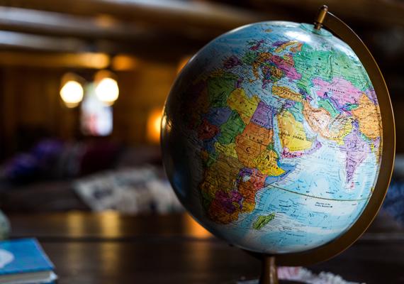 A globe on a desk in a library