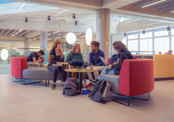 Undergrad students studying together in the Hunter Hub Student Commons