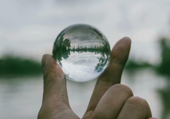 Close-Up Photography of Person Holding Crystal Ball