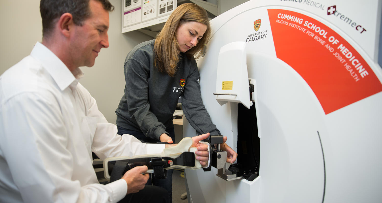 Grad student scans a patient's arm