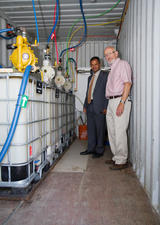 Researchers with some machinery