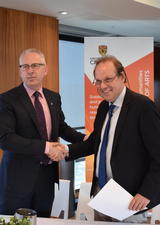 Ed McCauley and Jurgen shake hands