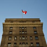 Building in Calgary with a Canada flag 